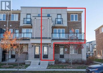 Kitchener townhouse for rent - A building with a red rectangle drawn on it and a tree with orange leaves.