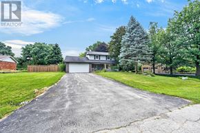 Hamilton (Freelton) apartment for rent - A house with a driveway in front of it.