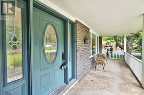 Hamilton (Freelton) apartment for rent - A blue door with a glass window and a mirror above it.