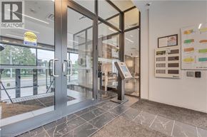 Waterloo condo for rent - The image shows the entrance to a realtor office with a glass door and a yellow caution sign on it.