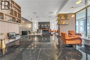 Waterloo condo for rent - A modern office lobby with a marble floor and contemporary furniture.