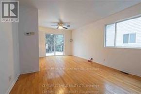 South Glengarry apartment for rent - A room with a wooden floor and a ceiling fan.