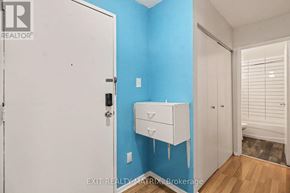 Ottawa condo for rent - A white door with a black handle is open to a room with blue walls.