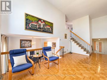 Markham (German Mills) apartment for rent - A living room with two blue chairs and a painting on the wall.
