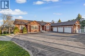 Milton apartment for rent - A large house with a driveway in front of it.