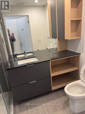 Mississauga (Mississauga Valleys) house for rent - A bathroom with a sink, toilet and mirror.