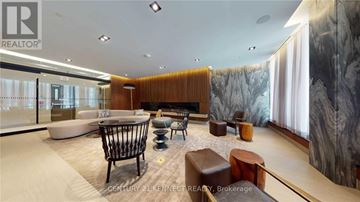 Toronto (Mount Pleasant West) condo for rent - A modern living room with a large sofa and a coffee table.