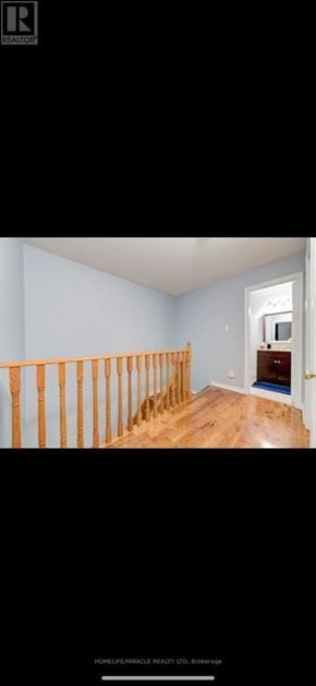 Brampton (Sandringham-Wellington) townhouse for rent - A room with wooden floors and white walls.
