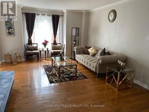 Brampton (Sandringham-Wellington) townhouse for rent - A living room with a couch, a chair, and a coffee table.