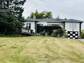 Fort Erie (Central) apartment for rent - A white house with a black and white checkered pillar in front of it.