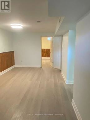 Vaughan (Glen Shields) apartment for rent - A room with wooden flooring and white walls.