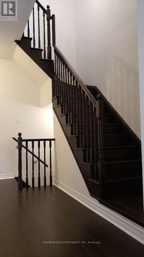 Markham (Greensborough) townhouse for rent - A staircase with a black railing and wooden steps.