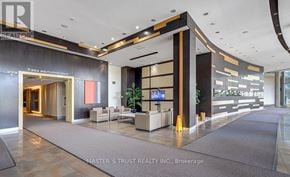 Markham (Commerce Valley) condo for rent - A reception area with a TV and seating area.
