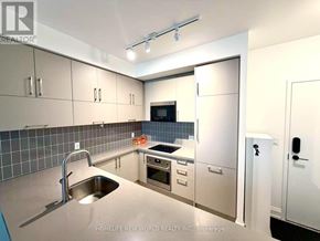 Markham (Unionville) condo for rent - A modern kitchen with a sink, stove, and refrigerator.