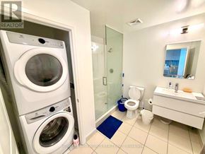 Markham (Unionville) condo for rent - A small bathroom with a washer and dryer built in.