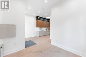 Toronto (Bendale) apartment for rent - A brokerage office with a white wall and a wooden cabinet.