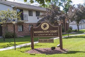 Cedarburg apartment for rent - a sign court apartments in front of a house