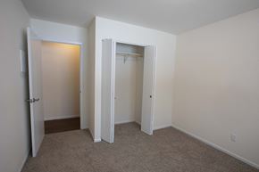 Cedarburg apartment for rent - a bedroom with a closet and a door to a wardrobe