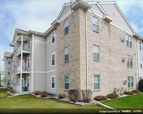 Cedarburg apartment for rent - a brick building with a balcony on the side of it