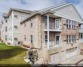 Cedarburg apartment for rent - a brick house with a balcony on the side