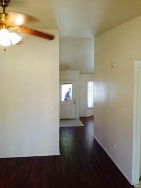Lanacaster house for rent - A room with a ceiling fan and a doorway leading to another room.