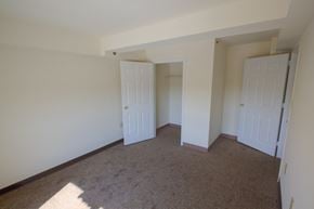 Newark apartment for rent - Bedroom with closet and carpeted floors