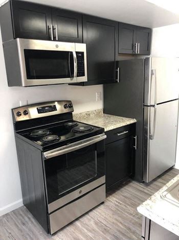 New stainless appliances- range, refrigerator, microwave, & dishwasher