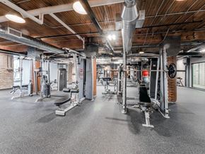 Chicago apartment for rent - Chicago luxury apartment fitness center gym amenity with treadmills, bikes, boxing punching bags, free weights, and ellipticals