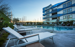 Marina Del Rey apartment for rent - a pool with chairs in front of an apartment building