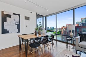 Chicago apartment for rent - Dining table focused living room shot at Kingsbury Plaza, Chicago