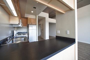 San Francisco apartment for rent - a kitchen with a black counter top and a sink
