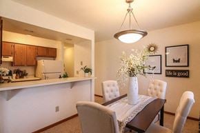Middleton apartment for rent - a dining room table with a vase of flowers