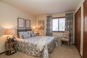 Madison apartment for rent - a bedroom with a bed and a window