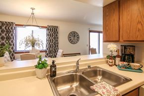 Madison apartment for rent - a kitchen with a sink and a clock on the wall