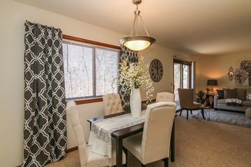 Madison apartment for rent - an open living room and dining room with a table and chairs