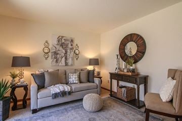 Madison apartment for rent - a living room with a couch and a mirror on the wall