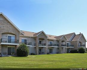 Sun Prairie apartment for rent - a large yard in front of a building