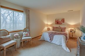 Madison apartment for rent - a bedroom with a bed and a large window