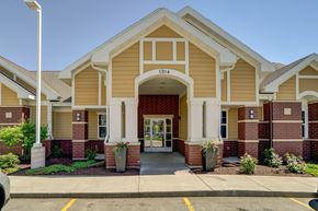 Sun Prairie apartment for rent - the front of a building with a porch and a walkway