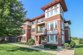 Madison apartment for rent - a red brick apartment building with a sidewalk in front of it