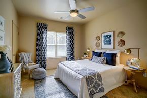 Madison apartment for rent - a bedroom with a bed and a ceiling fan