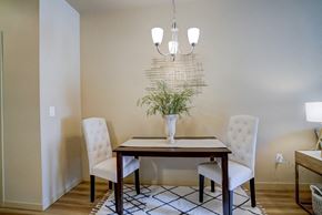 Madison apartment for rent - a dining room with a table and chairs and a chandelier