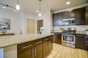 Madison apartment for rent - a kitchen with stainless steel appliances and a marble counter top