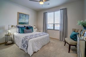 Madison apartment for rent - a bedroom with a large bed and a window