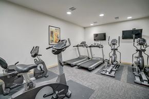 Madison apartment for rent - the gym is equipped with cardio equipment and weights