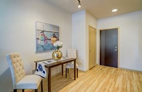 Madison apartment for rent - a dining room with a table and chairs and a painting on the wall