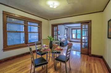 Madison apartment for rent - a dining room and living room with a table and chairs