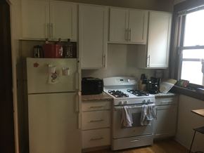 Madison apartment for rent - a kitchen with white appliances and white cabinets