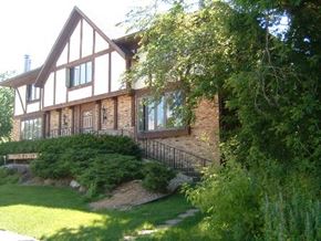 Middleton apartment for rent - a large brick house with a lawn and trees