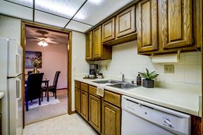 Middleton apartment for rent - a kitchen with a sink and a refrigerator     and a dining room